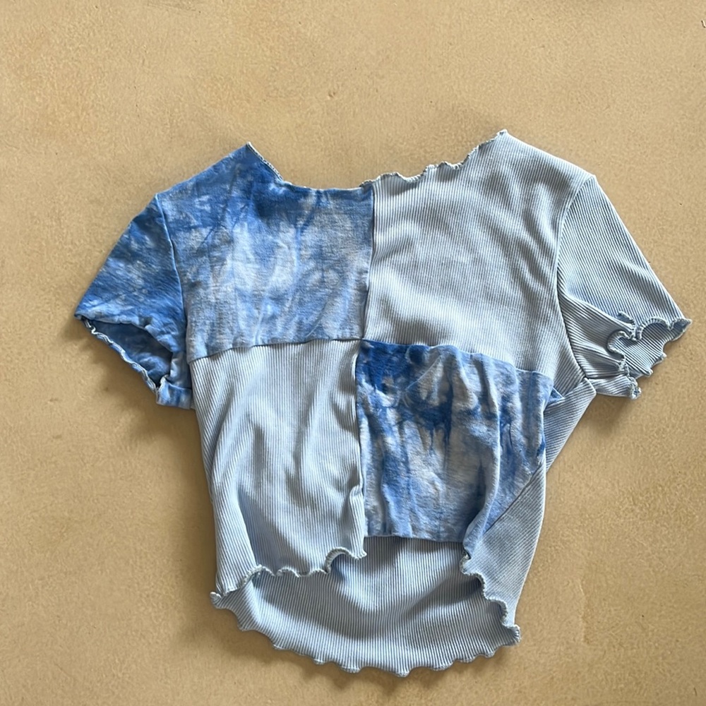 It is from Honu Hut. It is light and dark blue and it’s a size small.